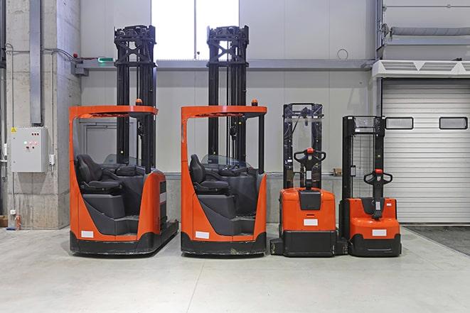 forklifts lined up at a factory